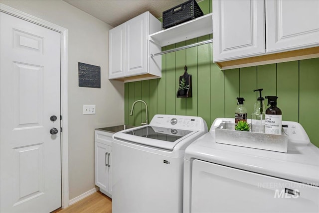 1827 Targhee Dr, Twin Falls, ID 83301 - laundry room with independent washer and dryer, cabinet space, and light wood-type flooring