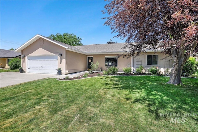 1827 Targhee Dr, Twin Falls, ID 83301 - ranch-style home with stucco siding, an attached garage, driveway, and a front lawn