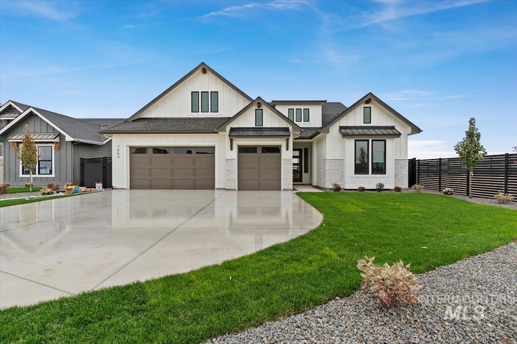 7804 W Daybreak Run Ct, Meridian, ID 83646 - modern farmhouse featuring fence, an attached garage, a front lawn, board and batten siding, and driveway
