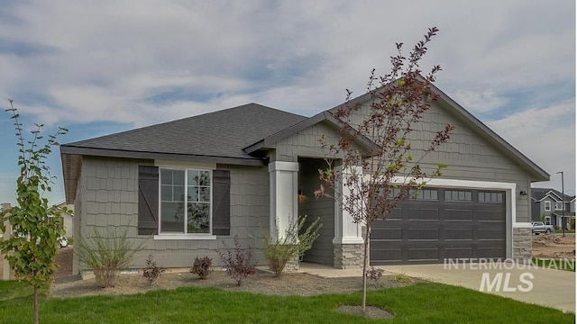 11922 W Box Canyon St, Star, ID 83669 - single story home with an attached garage, concrete driveway, and a shingled roof