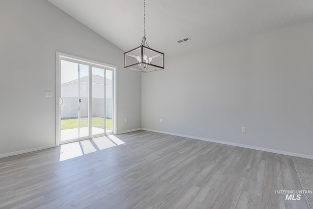 11922 W Box Canyon St, Star, ID 83669 - spare room featuring a chandelier, light wood-type flooring, lofted ceiling, and baseboards