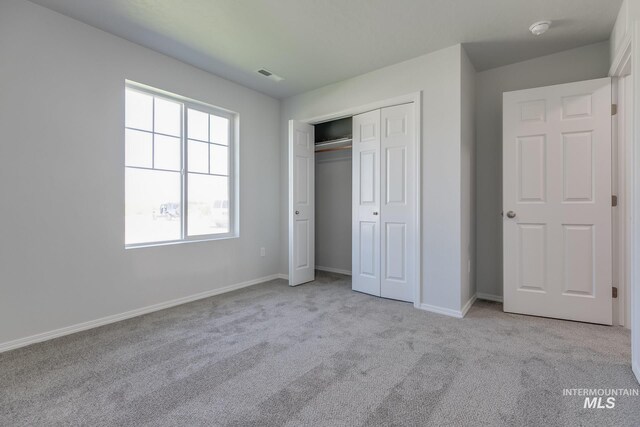 11922 W Box Canyon St, Star, ID 83669 - unfurnished bedroom featuring carpet flooring, baseboards, and a closet
