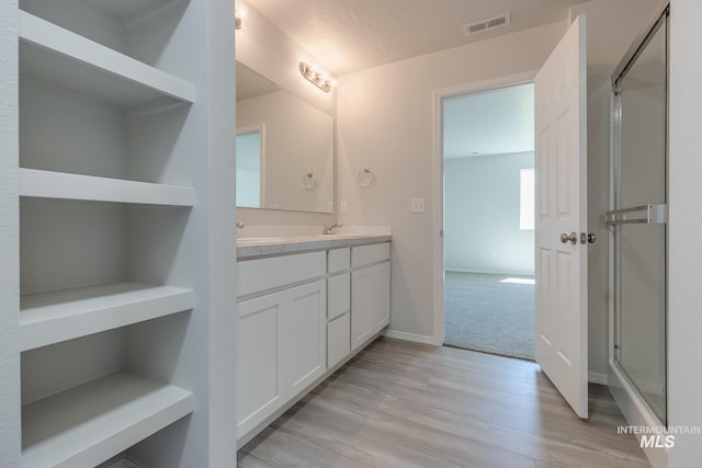 11922 W Box Canyon St, Star, ID 83669 - full bath with double vanity, wood finished floors, and baseboards