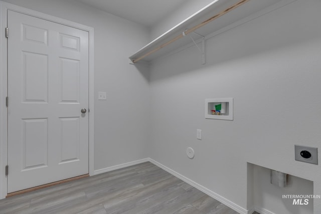 11922 W Box Canyon St, Star, ID 83669 - washroom featuring electric dryer hookup, hookup for a washing machine, light wood finished floors, baseboards, and gas dryer hookup