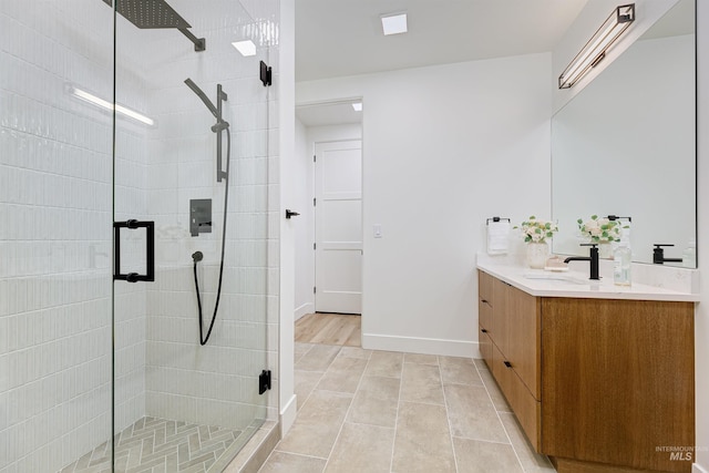55 E State St Unit 303, Eagle, ID 83616 - bathroom featuring vanity, tile patterned flooring, and an enclosed shower