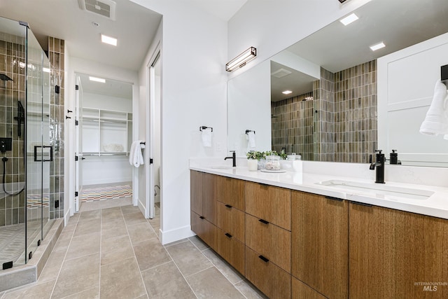 55 E State St Unit 303, Eagle, ID 83616 - bathroom with a shower with door, tile patterned floors, and vanity