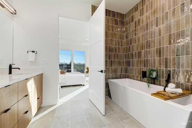 55 E State St Unit 303, Eagle, ID 83616 - bathroom with a bathtub, tile walls, tile patterned floors, and vanity