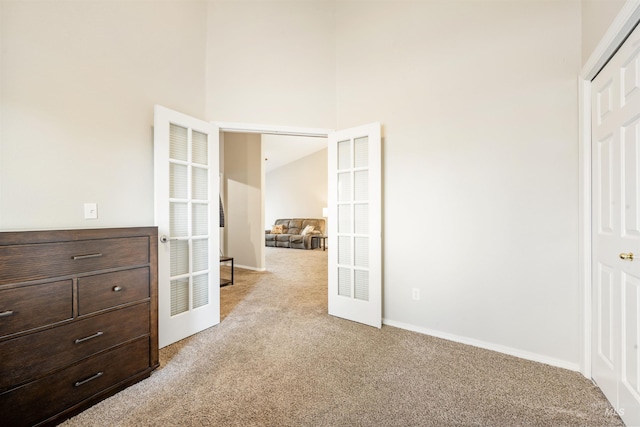 3189 S Kramer Ln, Boise, ID 83706 - unfurnished bedroom with baseboards, a towering ceiling, and light carpet