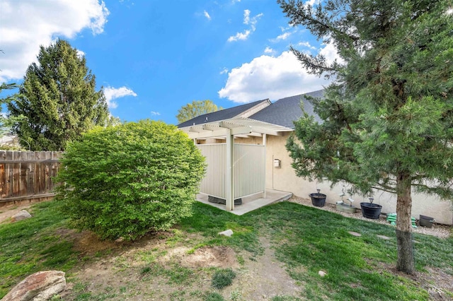 3189 S Kramer Ln, Boise, ID 83706 - rear view of house featuring a pergola, fence, and stucco siding