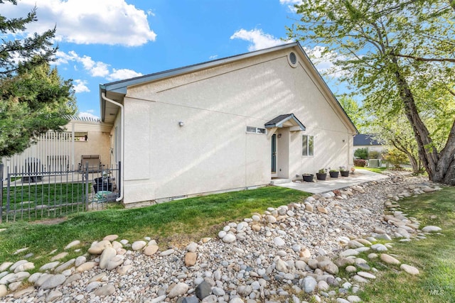 3189 S Kramer Ln, Boise, ID 83706 - rear view of property with a patio, fence, and stucco siding