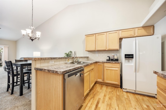 3189 S Kramer Ln, Boise, ID 83706 - kitchen featuring light brown cabinetry, vaulted ceiling, dishwasher, a peninsula, and white fridge with ice dispenser