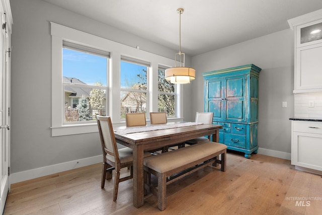 1315 N Luge Ave, Eagle, ID 83616 - dining area with light wood-type flooring and baseboards