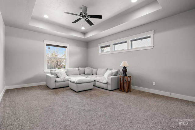 1315 N Luge Ave, Eagle, ID 83616 - living area featuring a tray ceiling, baseboards, recessed lighting, a ceiling fan, and carpet