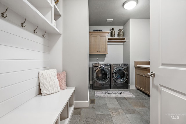 1315 N Luge Ave, Eagle, ID 83616 - washroom featuring cabinet space, separate washer and dryer, baseboards, and stone finish floors