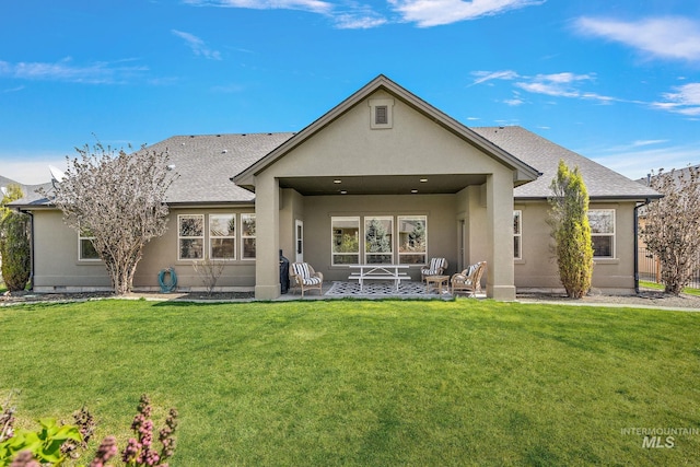 1315 N Luge Ave, Eagle, ID 83616 - rear view of property featuring a patio, stucco siding, a lawn, and roof with shingles