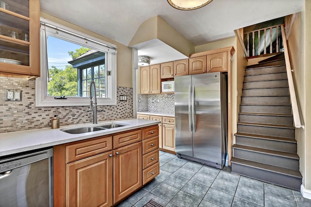 913 N 22nd St, Boise, ID 83702 - kitchen with appliances with stainless steel finishes, a sink, light countertops, glass insert cabinets, and light tile patterned floors