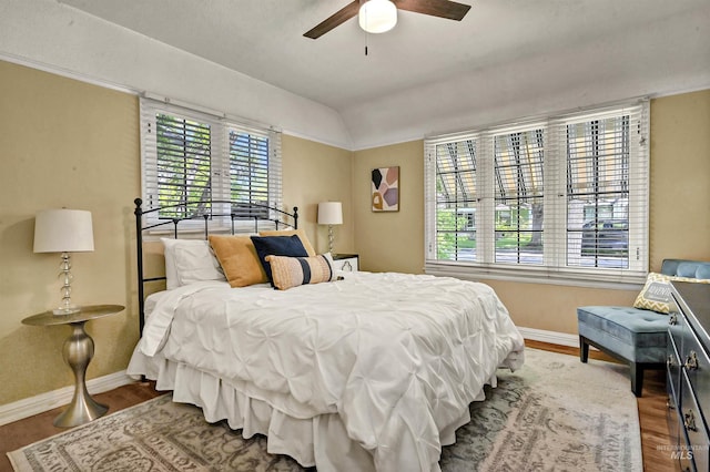 913 N 22nd St, Boise, ID 83702 - bedroom featuring baseboards, multiple windows, wood finished floors, lofted ceiling, and a ceiling fan