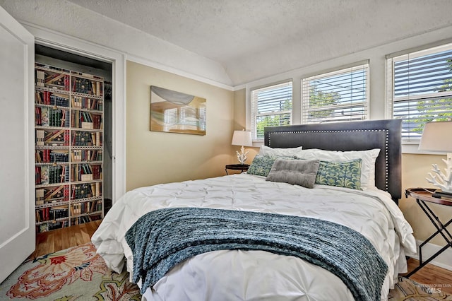 913 N 22nd St, Boise, ID 83702 - bedroom featuring wood finished floors and lofted ceiling