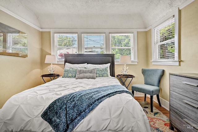 913 N 22nd St, Boise, ID 83702 - bedroom featuring wood finished floors, baseboards, and vaulted ceiling