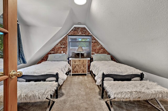 913 N 22nd St, Boise, ID 83702 - carpeted bedroom with brick wall and lofted ceiling