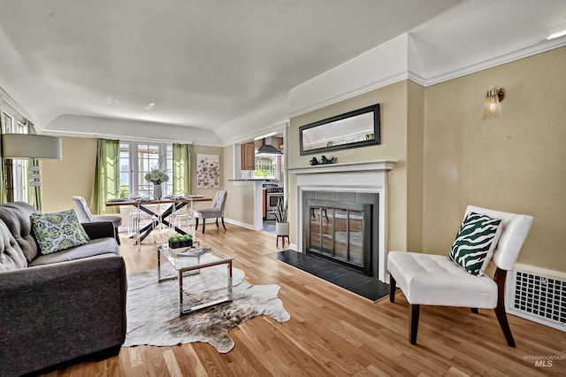 913 N 22nd St, Boise, ID 83702 - living area with wood finished floors, a fireplace, and baseboards