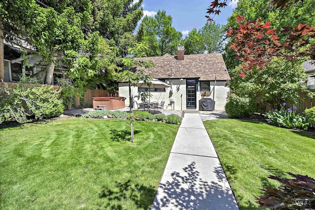 913 N 22nd St, Boise, ID 83702 - view of front of home featuring a hot tub, a chimney, a patio, and roof with shingles