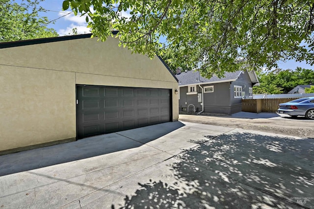 913 N 22nd St, Boise, ID 83702 - view of front of home with stucco siding and a garage