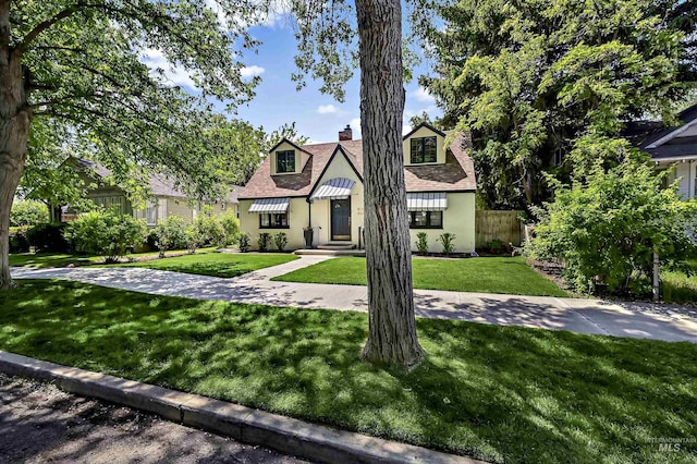 913 N 22nd St, Boise, ID 83702 - tudor home featuring a chimney and stucco siding