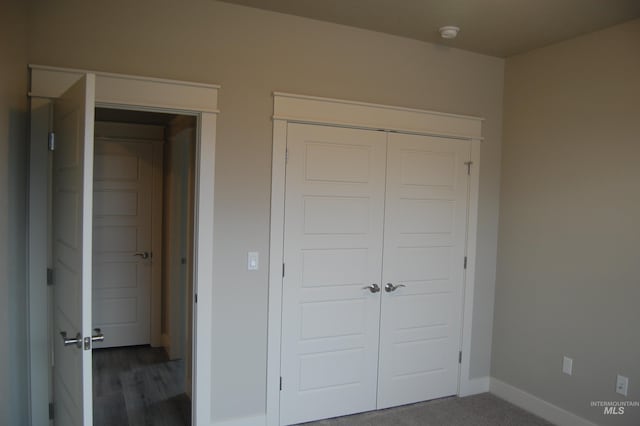 unfurnished bedroom with a closet