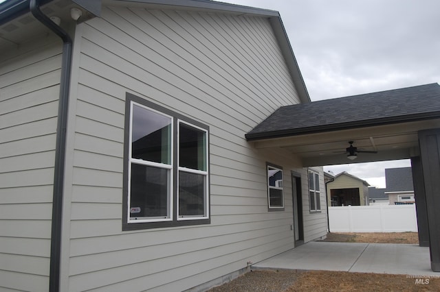 view of side of home featuring a patio and ceiling fan