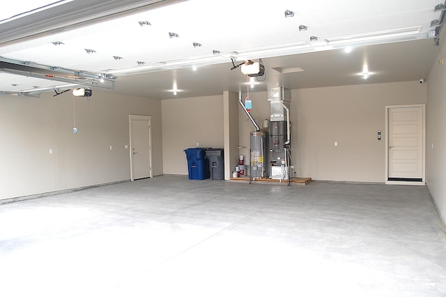 garage featuring a garage door opener and water heater