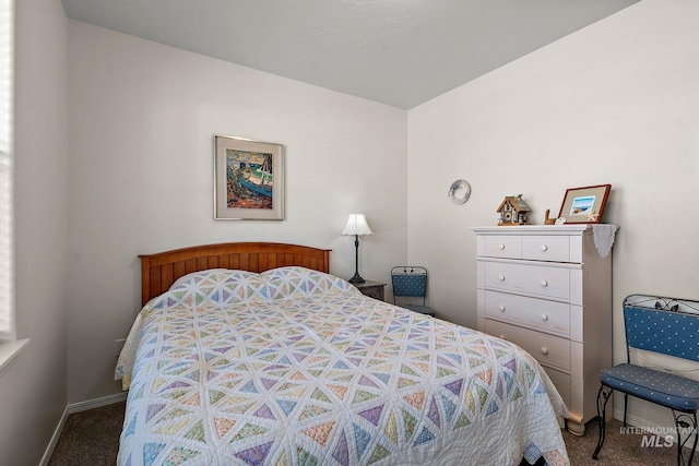 carpeted bedroom with baseboards