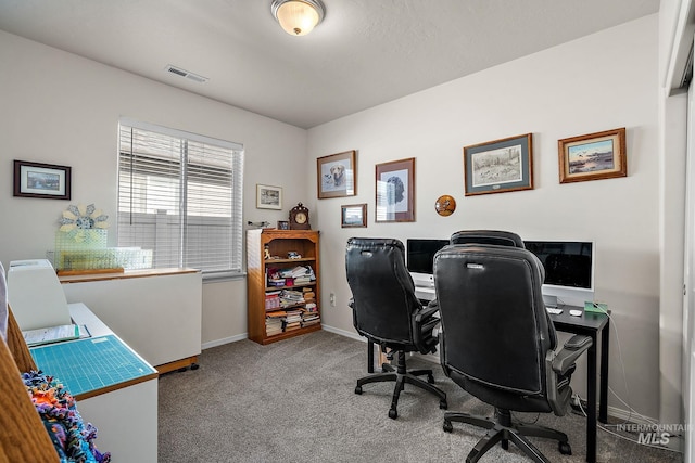 office with carpet flooring, visible vents, and baseboards