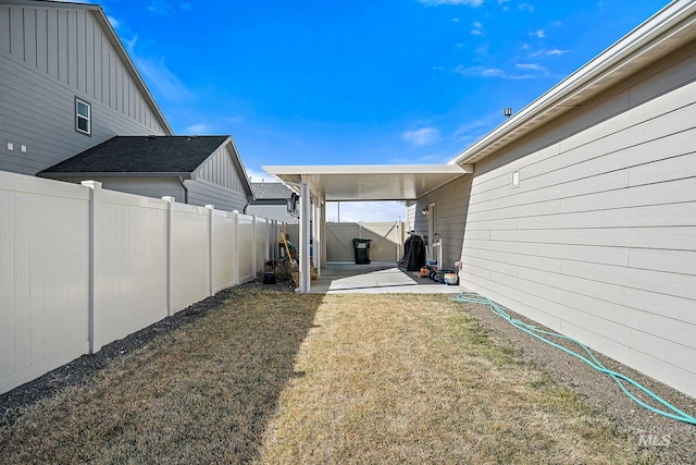 view of yard with a patio area and a fenced backyard