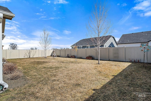 view of yard with a fenced backyard