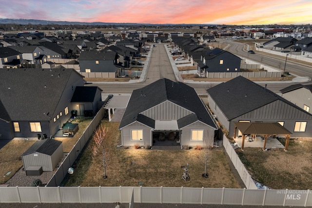 birds eye view of property with a residential view