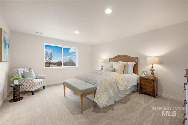 bedroom with light colored carpet