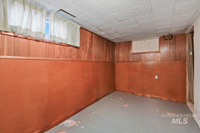 basement with wooden walls