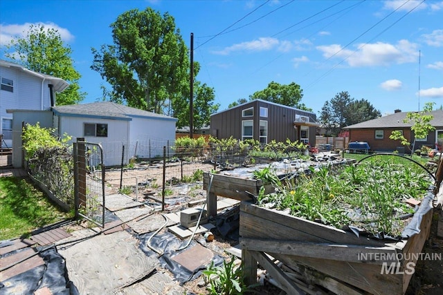 view of yard with a garden and fence