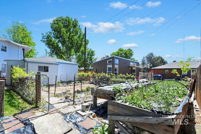 view of yard with a garden and fence