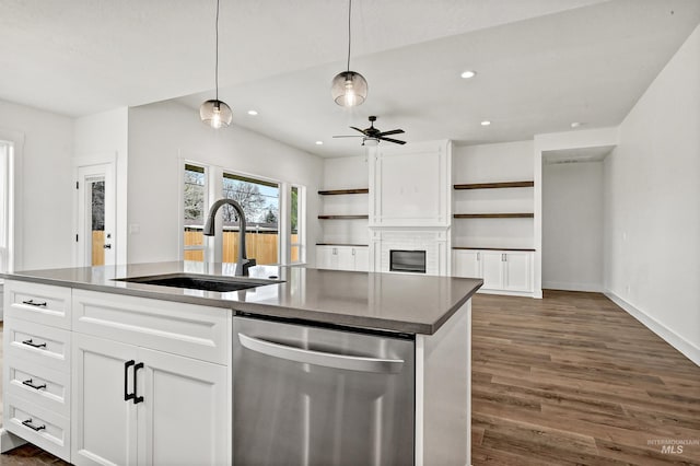 kitchen with dark wood finished floors, open shelves, ceiling fan, a sink, and stainless steel dishwasher