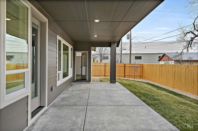 view of patio featuring fence