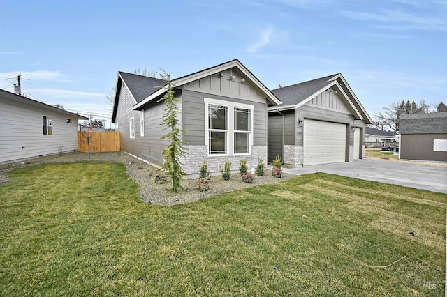 view of front facade with a front lawn, fence, board and batten siding, concrete driveway, and an attached garage