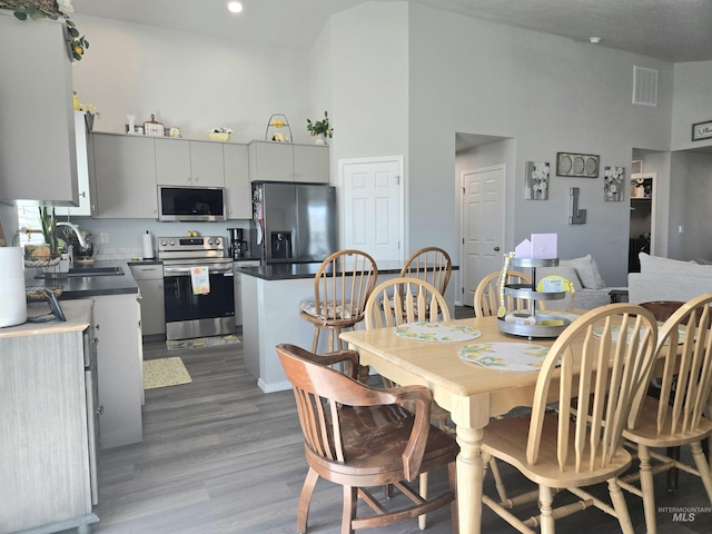 19339 Susquehanna Way, Caldwell, ID 83605 - dining area with high vaulted ceiling, wood finished floors, and recessed lighting