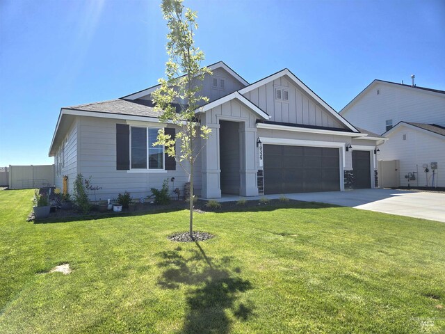 19339 Susquehanna Way, Caldwell, ID 83605 - view of front facade with an attached garage, board and batten siding, driveway, and a front lawn
