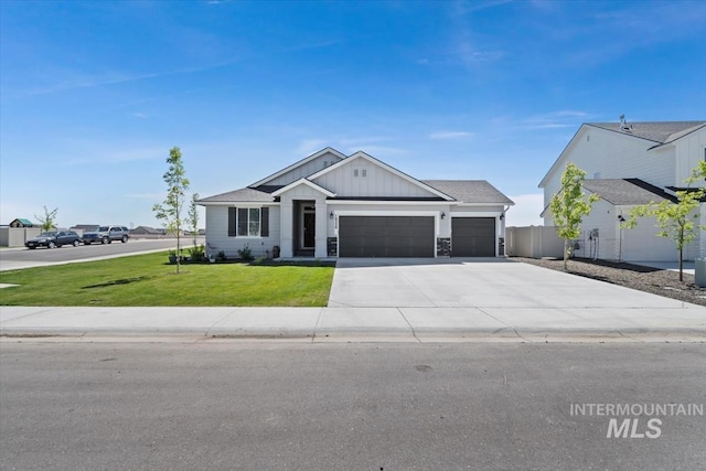 19339 Susquehanna Way, Caldwell, ID 83605 - view of front facade with board and batten siding, an attached garage, and concrete driveway