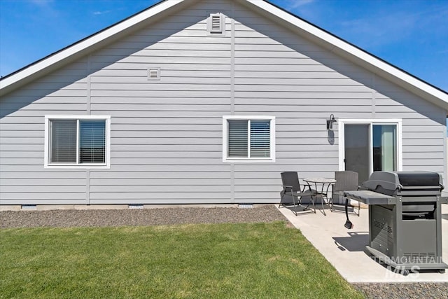 19339 Susquehanna Way, Caldwell, ID 83605 - back of house with crawl space, a patio, and a yard
