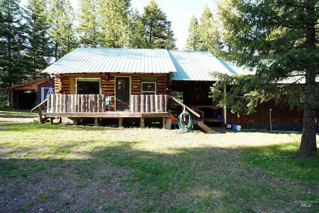 3695 W Mountain Rd, Anatone, WA 99401 - view of front of house with log siding, metal roof, a front yard, and a standing seam roof
