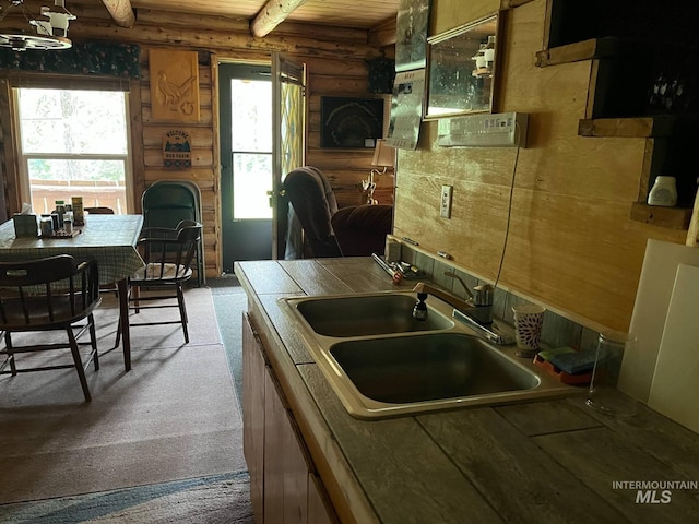 3695 W Mountain Rd, Anatone, WA 99401 - kitchen with rustic walls, a sink, plenty of natural light, carpet flooring, and tile countertops