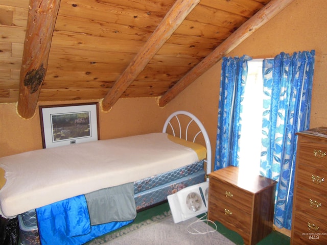 3695 W Mountain Rd, Anatone, WA 99401 - bedroom with wooden ceiling, beam ceiling, and carpet flooring